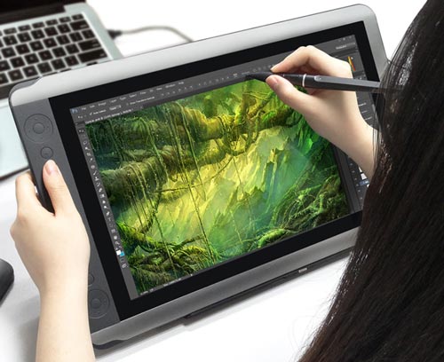 Woman drawing with a graphics tablet